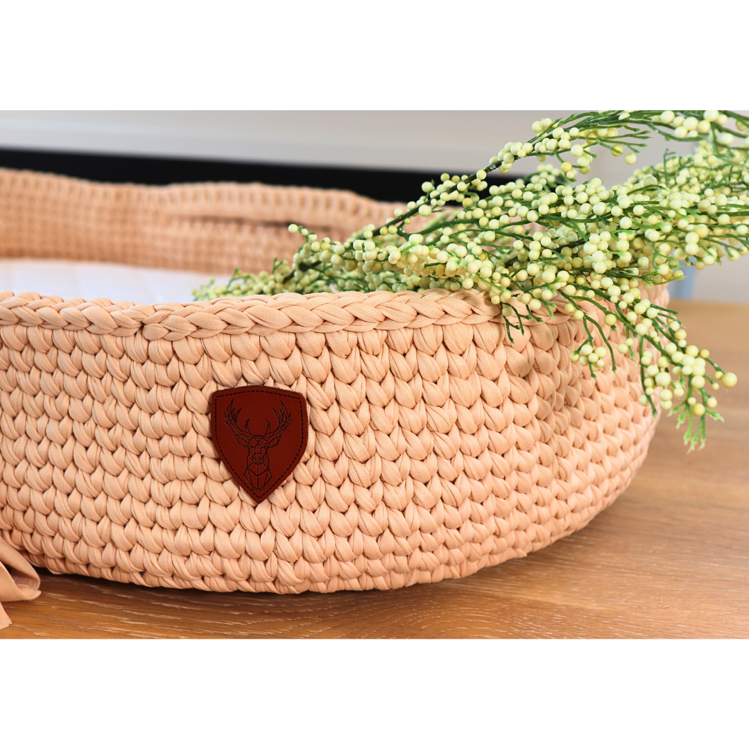 Handmade baby changing basket showcasing artisanal craftsmanship and bohemian charm.