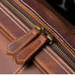 Top closeup view of brown leather duffel bag showing the zipper